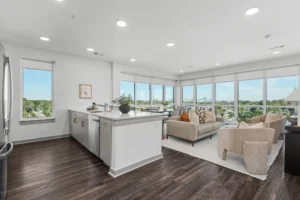 Open-concept apartment kitchen and living room with Nashville views at 445 Park Commons