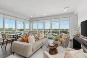 Bright apartment living room with Downtown Nashville skyline views at 445 Park Commons